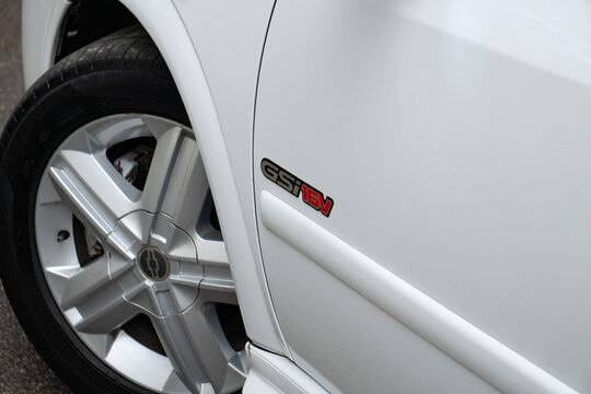 White Chevrolet Astra GSI fender badge close up, Classic hot hatch trim logo detail outdoors
