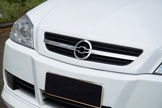 White Chevrolet Astra front end badge close up, Classic hot hatch external detail outdoors