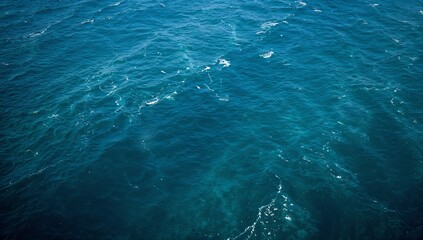 Fototapeta premium Sparkling Blue Sea Water Surface with Gentle Waves and Sun Reflections