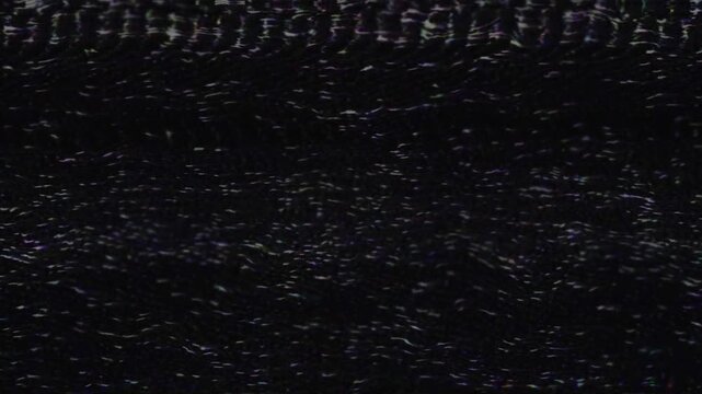 Static black and white noise on television screen creating a vintage vhs effect with glitching lines and bad signal motion.