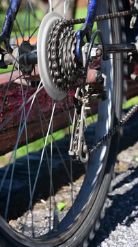 Bicycle chain and wheel spinning, authentic vertical video, used bike