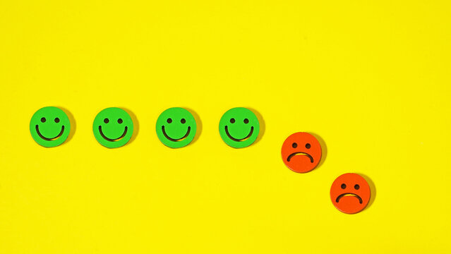 Mood change concept with smile and sad faces. Emotional shift and changing mental state.