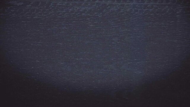 Dark static noise on old television screen retro background with analog interference and grain.