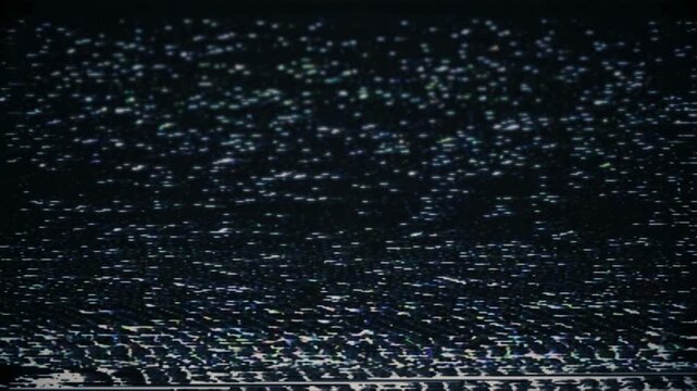 Abstract digital glitch effect on dark background with futuristic technology motion.