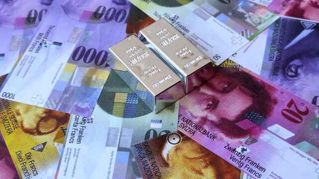 A silver bar, white metal against a backdrop of Swiss flag, as a concept for the sales market. A silver bar as a background for your design