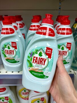 03.05.2026 Ukraine, Kharkov Woman's Hand Holding a Bottle of Fairy Sensitive Dishwashing Liquid in a Supermarket.
