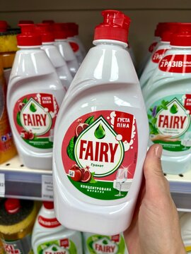 03.05.2026 Ukraine, Kharkov Woman's Hand Holding a Bottle of Fairy Sensitive Dishwashing Liquid in a Supermarket.