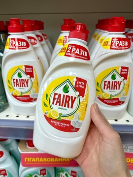 03.05.2026 Ukraine, Kharkov Woman's Hand Holding a Bottle of Fairy Sensitive Dishwashing Liquid in a Supermarket.