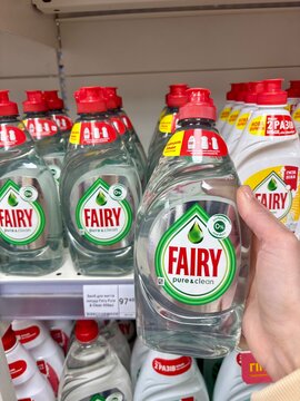 03.05.2026 Ukraine, Kharkov Woman's Hand Holding a Bottle of Fairy Sensitive Dishwashing Liquid in a Supermarket.