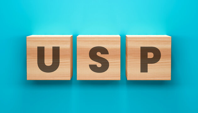 USP Concept in Blocks: Three wooden blocks arranged in a neat row spell out USP against a clean, uncluttered background, representing the unique selling proposition.