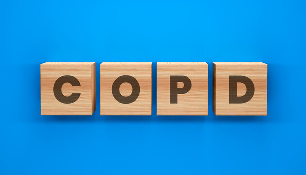 COPD in Focus: A visually engaging representation of COPD, crafted with wooden blocks against a stark blue backdrop.