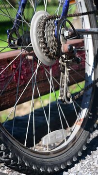 Bicycle chain and wheel spinning, authentic vertical video, used bike