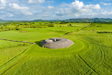 Aerial view of Carrowmore Passage Tomb surrounded by bright green fields in County Sligo, Ireland....