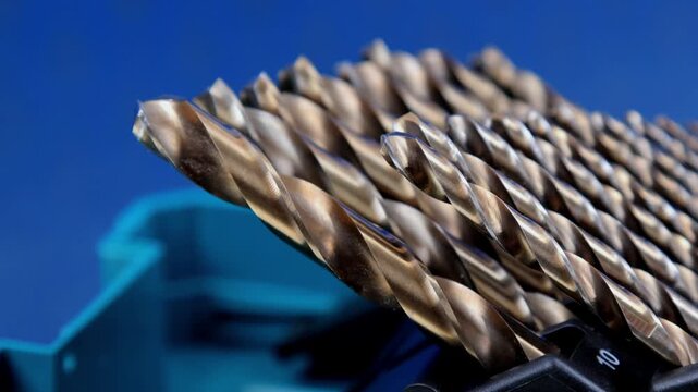 A set of drills for drilling metal in a plastic case.
