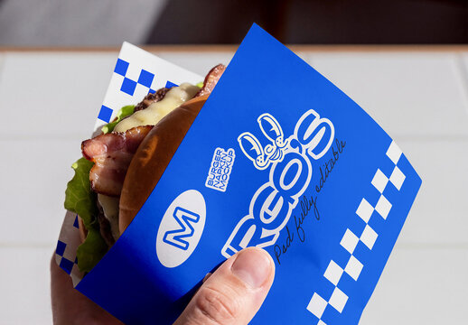 Hand Holding Burger Wrapper Packaging Mockup