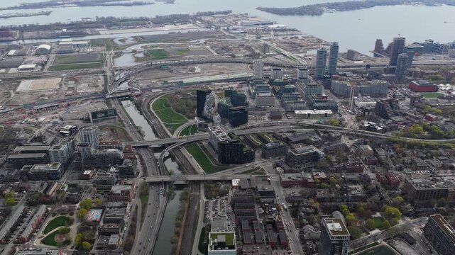 High angle of Corktown neighbourhood in Toronto, Canada revealing Don River and Gardiner Expressway with urban development and Port Lands area