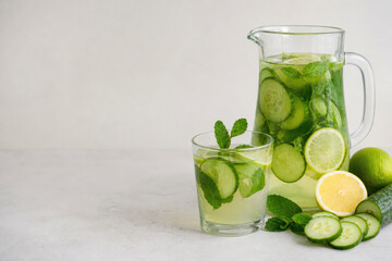 Fototapeta premium Cucumber drink with lemon and mint. Space for text.