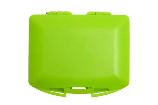 Closed green plastic box for storing dental aligner. Portable case for orthodontic retainer or mouthguard. Hygienic medical accessory isolated on white background. Dental care equipment.