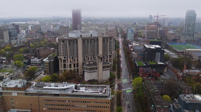 Robarts Library and University of Toronto campus on a cloudy and moody day showing urban architecture, towers and skyscrapers from above