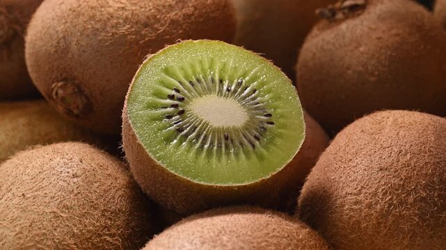 Fresh sliced kiwi macro with dappled sunlight through trees natural light