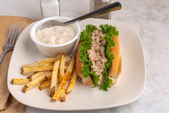 salmon salad  sandwich with french fries and chowder