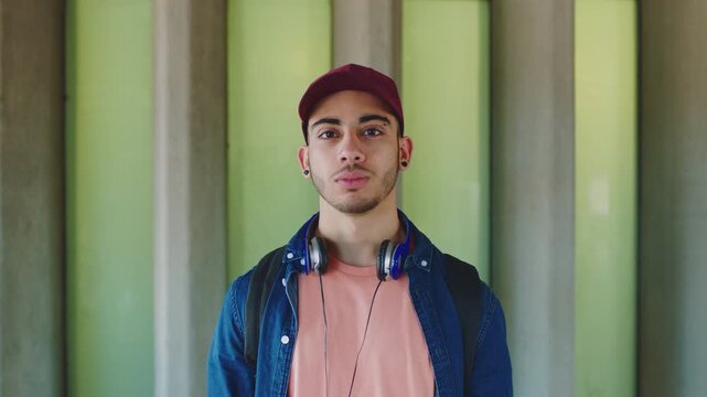 Man, face and serious student at university for learning, study opportunity and musicology course. Education, backpack and person on campus for semester start, music scholarship and creative academic