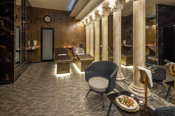 Fototapeta premium Opulent spa wellness center with marble columns and heated relaxation beds