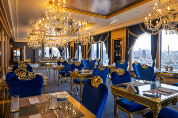 Fototapeta premium Grand luxury ballroom restaurant with crystal chandeliers and blue royal decor