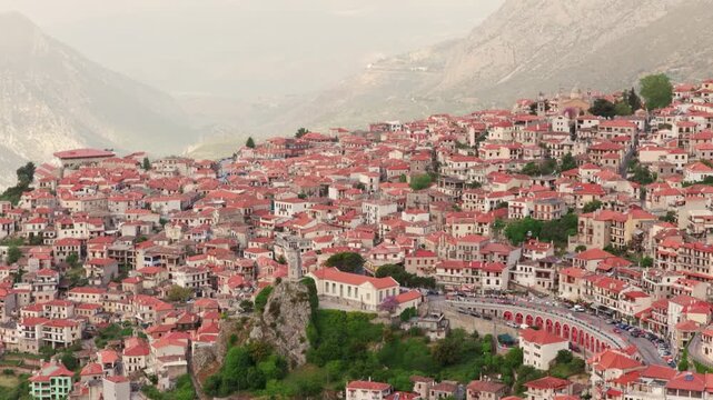 Picturesque mountain village of Arachova, Greece, showing traditional houses with red tile roofs nestled on the slopes of mount parnassus, a famous winter destination near Delphi