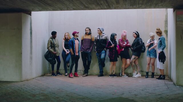 People, diversity or row with student group in parking lot for street audition or improv together. Team, dancers or friends in waiting line for choreography session, lesson or club on wall background