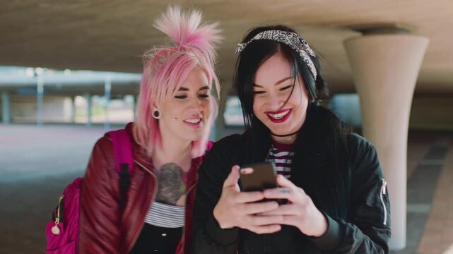 Happy women, student or phone with high five in city for good news, social media or academic results. Excited, female people or touch with smile, smartphone or bag for college acceptance together