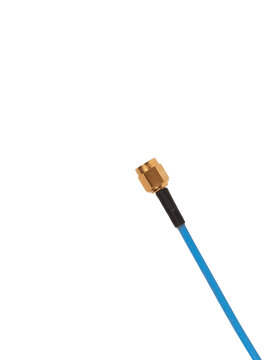 Blue coaxial cable with brass SMA connector is isolated