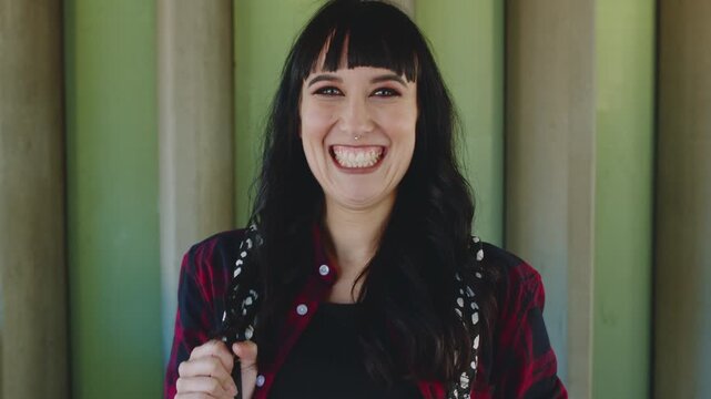 Face, girl and laugh with backpack at university for learning, study opportunity and semester start. Education, student portrait and happy on campus for academic course, scholarship and master degree