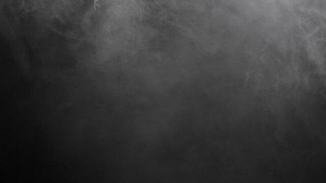 Cinematic Ethereal Fog & Mist Overlay. Focusing on the movement and texture of fog, smoke, and mist against a stark black background , slow-moving wisps and vertical "falling" transitions.