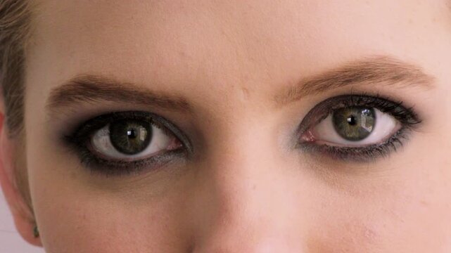 Eyes, makeup and face of woman for eyeshadow, cosmetics and makeover aesthetic with mascara. Cosmetology, blink and portrait of person with beauty, eyeliner and eyelash extension for glow and shine
