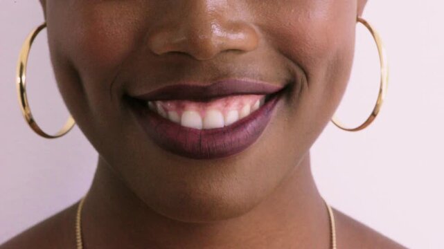 Happy, smile and mouth of woman in studio for positive attitude, dental care and wellness. Closeup, face and person with expression for teeth cleaning, health and oral hygiene on white background