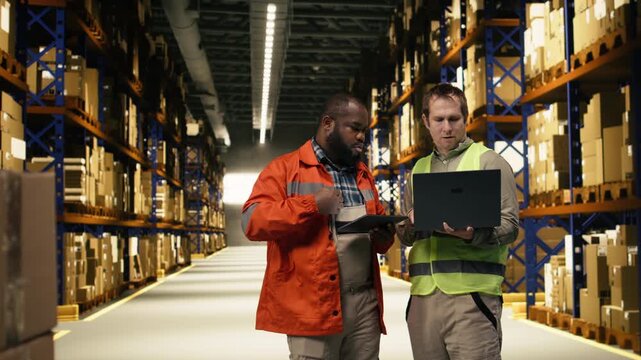 Multiethnic team, logistics on laptop and tablet, reviewing order fulfillment, colleagues monitoring shipment details and tracking info with AWB labels. Package tracking, depot operations.