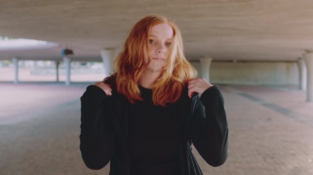 Happy girl, face and student with red hair in city for fashion, style or self confidence. Portrait, female person or academic with pride, hairstyle or hoodie for education, learning or development