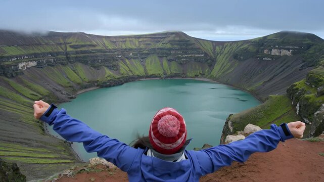 Travel adventure woman overlooking volcanic crater lake at Kerid Iceland
