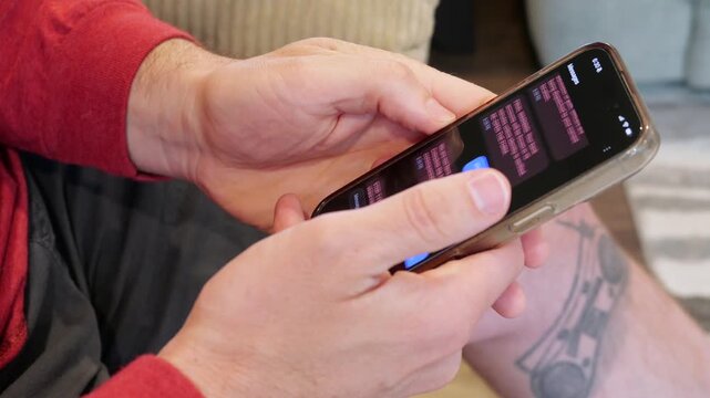 Close-up of smishing attempt on a mobile device showing a fake legal notice and a data collection form used by hackers to steal personal information