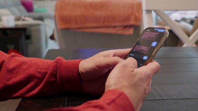 Close-up of smishing attempt on a mobile device showing a fake legal notice and a data collection form used by hackers to steal personal information