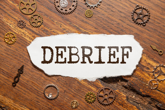 debrief word in a dictionary. debrief concept