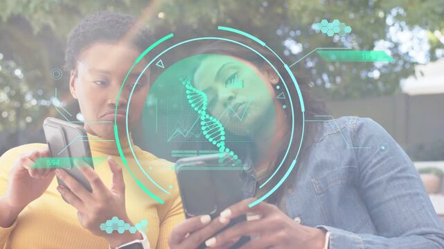 Two women sitting one scrolling phone, DNA HUD appearing leading other leaning in comparing health