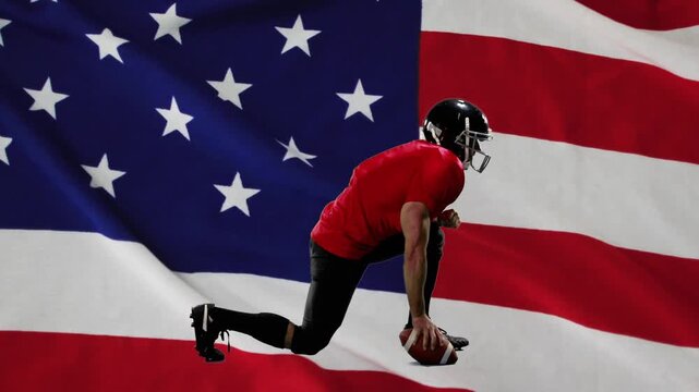 Male athlete shifting and pushing off ground, holding football to start run, flag accenting motion