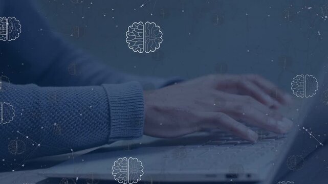 Man hovering hands then typing code, coding app with brain icons and particles moving over keyboard