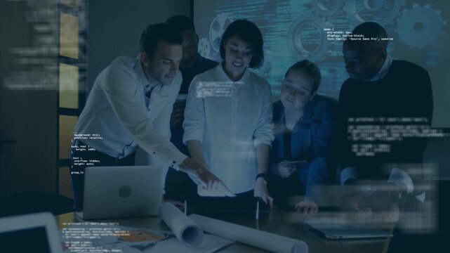 Lead woman straightening pointing at plans while team leaning tapping tabs code or gear overlay for 