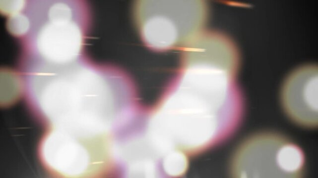Gold streaks moving, sparking faint glows as bokeh orbs growing and clustering, showing light shift