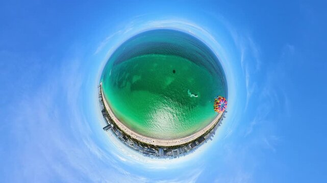 Parasailing over a tiny planet Miami Beach