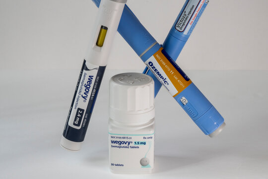 Wegovy tablets with injectable prescription weight loss medicines, Ozempic, Victoza and Wegovy on a white background