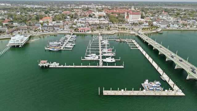 Aerial view of the Municipal Marina and Bridge of Lions with historic architecture and boats on the water in St. Augustine, Florida, United States.